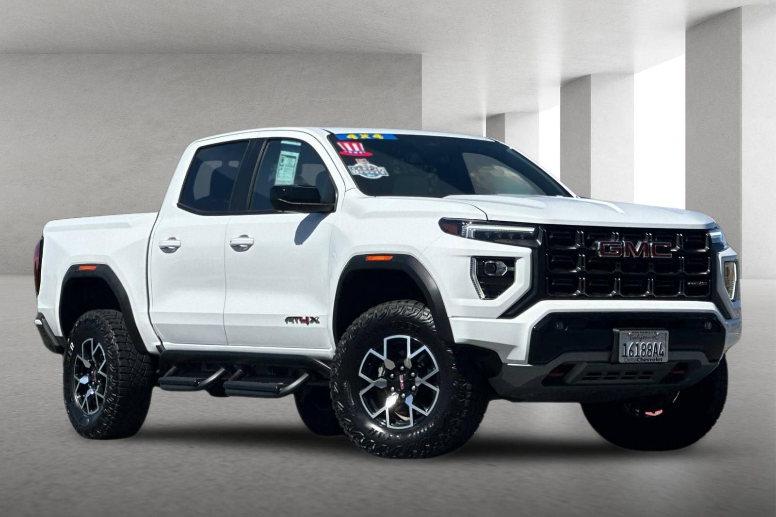 2024 GMC Canyon AT4X in Summit White — front three-quarter view